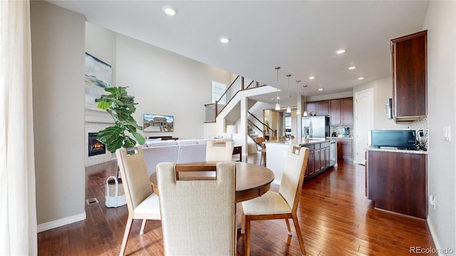 dining room with dark hardwood / wood-style floors