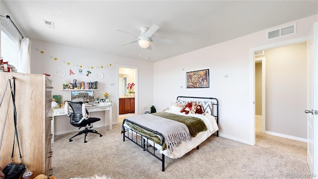 carpeted bedroom with ceiling fan and connected bathroom