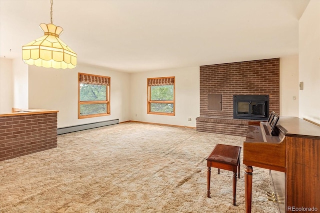 carpeted living room featuring brick wall, a baseboard heating unit, and a fireplace