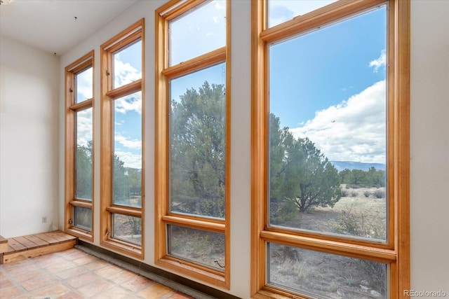 doorway with light tile flooring