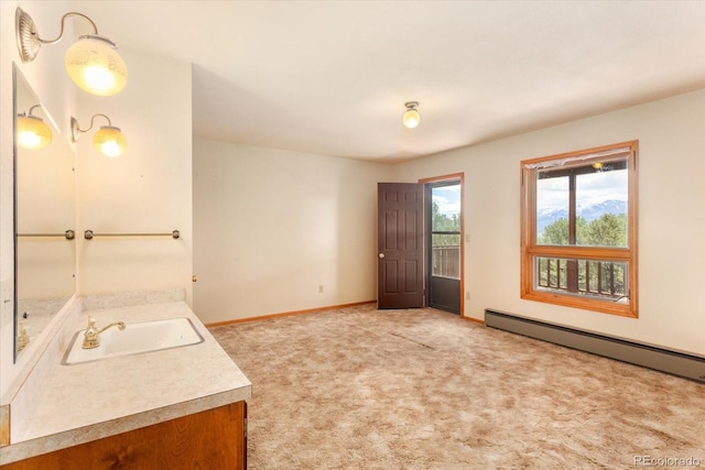 bathroom with vanity and a baseboard radiator