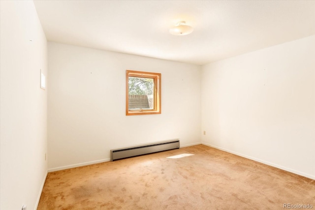 carpeted empty room with baseboard heating