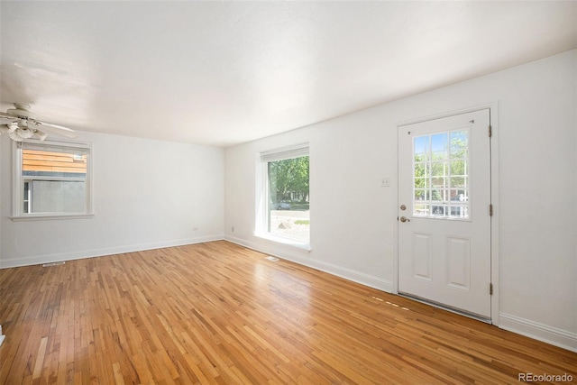 1355 Rosemary St, Denver, CO 80220 - unfurnished room featuring light wood-style floors, plenty of natural light, and baseboards