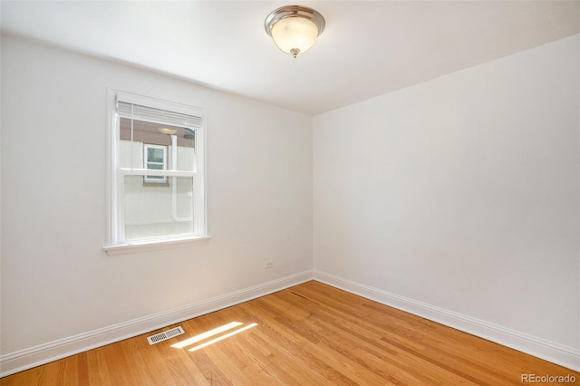1355 Rosemary St, Denver, CO 80220 - spare room with baseboards and wood finished floors
