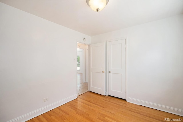 1355 Rosemary St, Denver, CO 80220 - unfurnished bedroom with light wood finished floors and baseboards