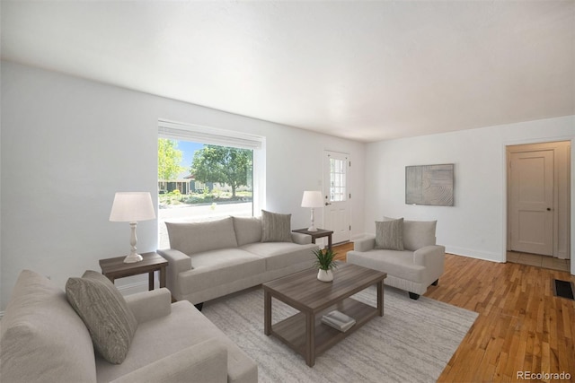 1355 Rosemary St, Denver, CO 80220 - living area with light wood finished floors and baseboards