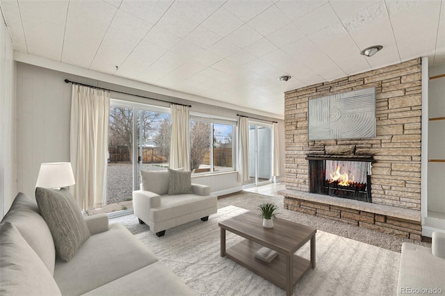 1355 Rosemary St, Denver, CO 80220 - living area featuring a fireplace and carpet floors