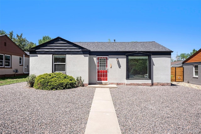 1355 Rosemary St, Denver, CO 80220 - view of front of home featuring stucco siding and roof with shingles