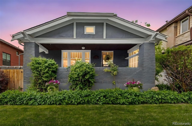 3341 Newton St, Denver, CO 80211 - view of front of property with brick siding and a porch