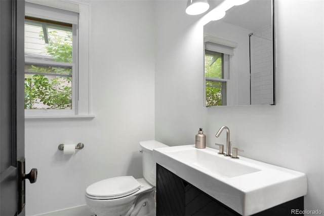 3341 Newton St, Denver, CO 80211 - half bath featuring plenty of natural light, toilet, and vanity