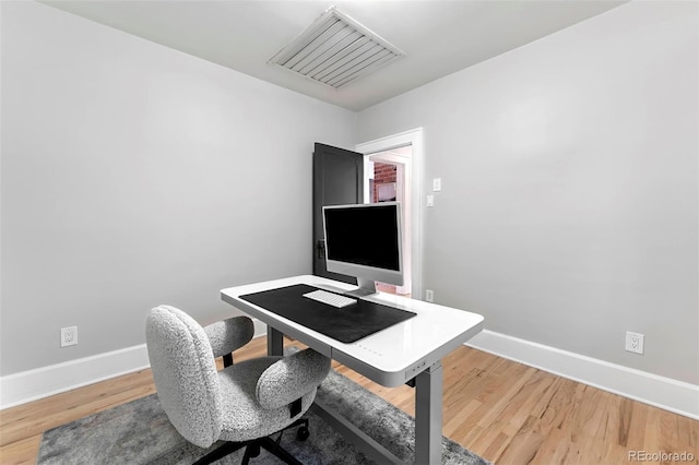 3341 Newton St, Denver, CO 80211 - office area featuring baseboards and light wood-style flooring