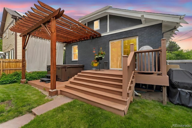 3341 Newton St, Denver, CO 80211 - back of house at dusk with a hot tub, a deck, and a pergola