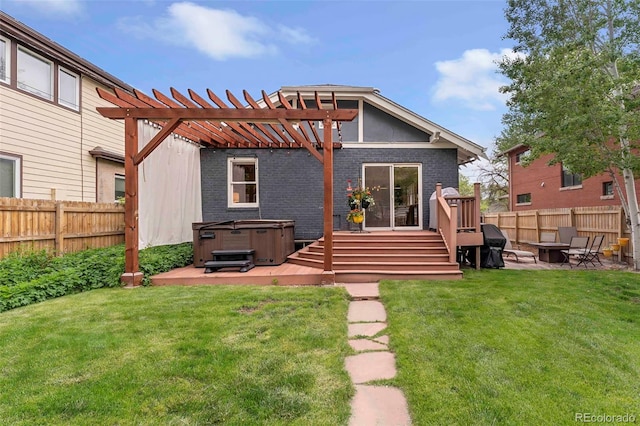 3341 Newton St, Denver, CO 80211 - rear view of house featuring a hot tub, a fire pit, brick siding, a deck, and a patio