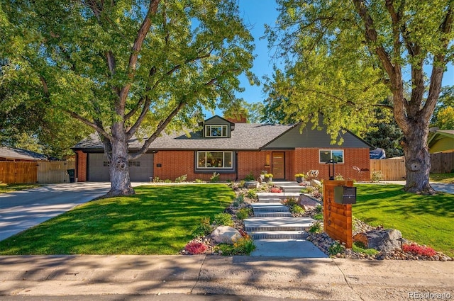 view of front facade featuring brick siding, driveway, a garage, and fence