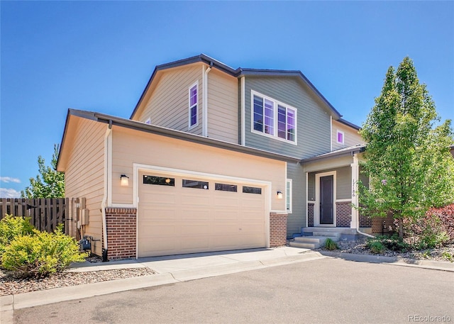 17186 E Cedar Gulch Dr, Parker, CO 80134 - view of front facade featuring brick siding, concrete driveway, and an attached garage