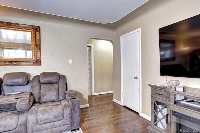 living room with dark hardwood / wood-style floors