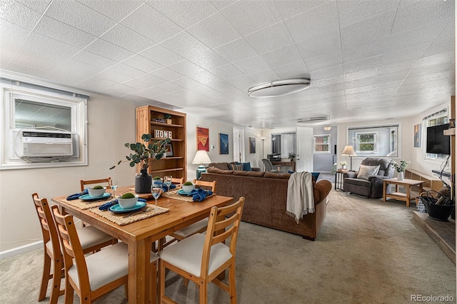 dining room featuring light colored carpet and cooling unit