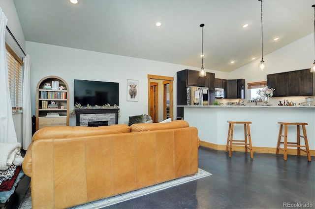 146 Raven Way, Buena Vista, CO 81211 - living area featuring a fireplace, recessed lighting, and lofted ceiling