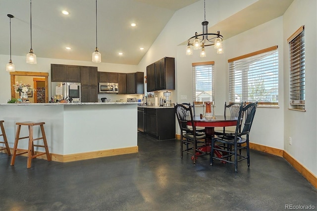 146 Raven Way, Buena Vista, CO 81211 - kitchen featuring appliances with stainless steel finishes, baseboards, lofted ceiling, hanging light fixtures, and light countertops