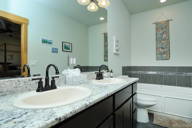 146 Raven Way, Buena Vista, CO 81211 - bathroom featuring double vanity, a garden tub, toilet, recessed lighting, and a chandelier