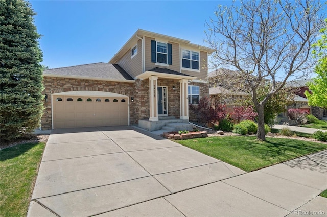 24738 E Layton Pl, Aurora, CO 80016 - view of front of home featuring an attached garage, a front lawn, driveway, and stone siding