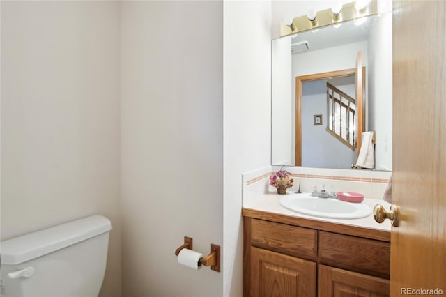 bathroom with vanity and toilet