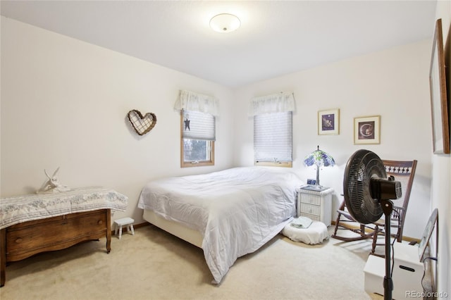 bedroom with light colored carpet