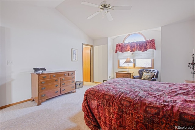 bedroom featuring lofted ceiling, light colored carpet, and ceiling fan