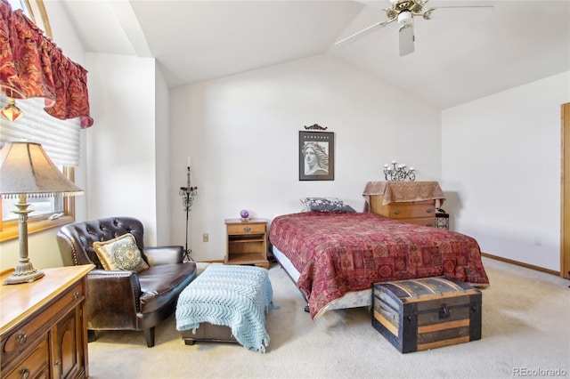 bedroom featuring lofted ceiling, ceiling fan, and light colored carpet