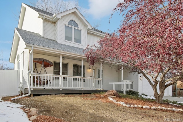 view of front of property with a porch and a garage