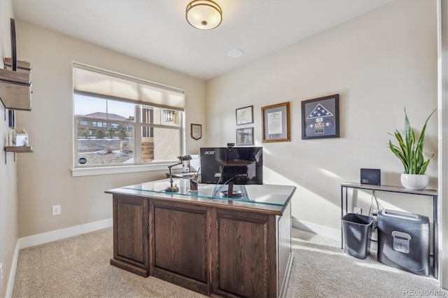 carpeted office with baseboards