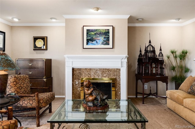 sitting room featuring ornamental molding, a premium fireplace, and carpet