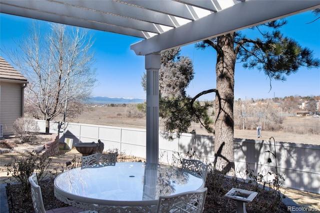 view of patio / terrace featuring outdoor dining area and fence