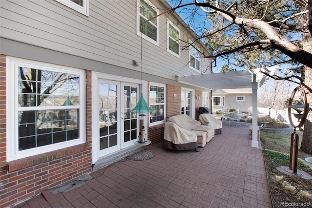 view of patio / terrace featuring outdoor dining space and french doors