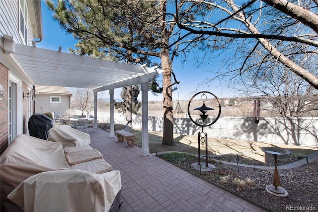 view of patio with a fenced backyard, a pergola, and area for grilling