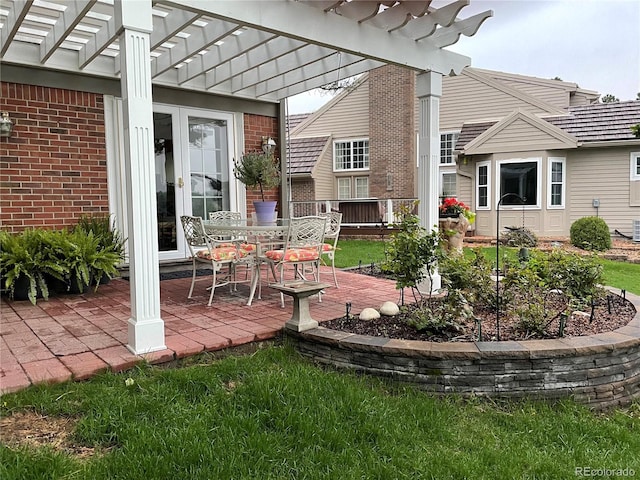 view of patio with french doors and a pergola