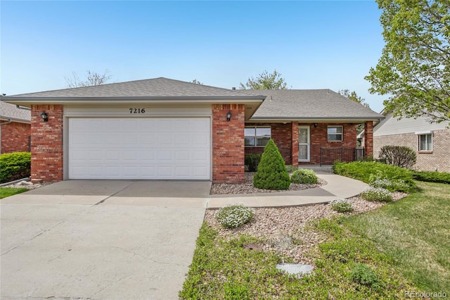 7216 W 18th St, Greeley, CO 80634 - single story home featuring roof with shingles, concrete driveway, an attached garage, and brick siding