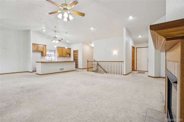 7216 W 18th St, Greeley, CO 80634 - unfurnished living room featuring visible vents, baseboards, lofted ceiling, and ceiling fan