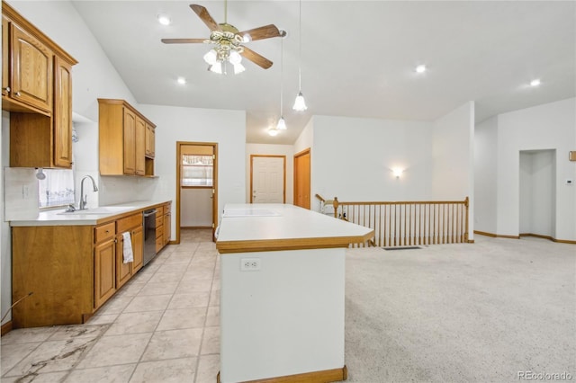 7216 W 18th St, Greeley, CO 80634 - kitchen with a sink, dishwasher, light countertops, a ceiling fan, and a kitchen island