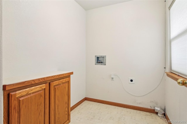 7216 W 18th St, Greeley, CO 80634 - clothes washing area with light floors, baseboards, hookup for a washing machine, cabinet space, and electric dryer hookup