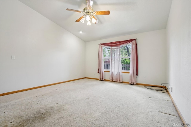 7216 W 18th St, Greeley, CO 80634 - carpeted spare room featuring lofted ceiling, baseboards, and a ceiling fan