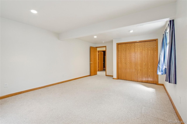 7216 W 18th St, Greeley, CO 80634 - unfurnished bedroom with light carpet, baseboards, and recessed lighting