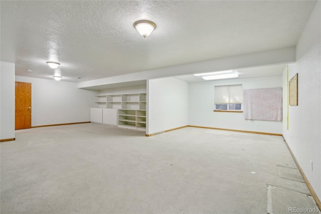 7216 W 18th St, Greeley, CO 80634 - finished basement with baseboards, a textured ceiling, and carpet floors