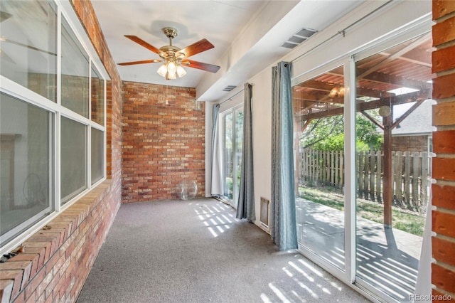 7216 W 18th St, Greeley, CO 80634 - unfurnished sunroom featuring brick wall, ceiling fan, carpet flooring, and visible vents