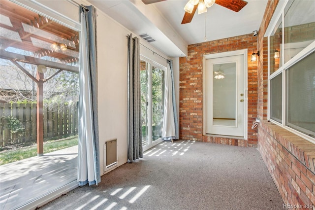 7216 W 18th St, Greeley, CO 80634 - interior space with visible vents, ceiling fan, and brick wall