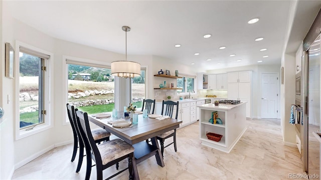 dining room with a chandelier, marble finish floor, recessed lighting, and baseboards