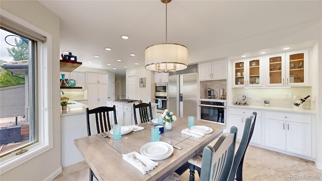 dining room with recessed lighting