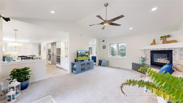 10886 Pheasant Run, Littleton, CO 80125 - living area featuring ceiling fan, lofted ceiling, a stone fireplace, light carpet, and recessed lighting