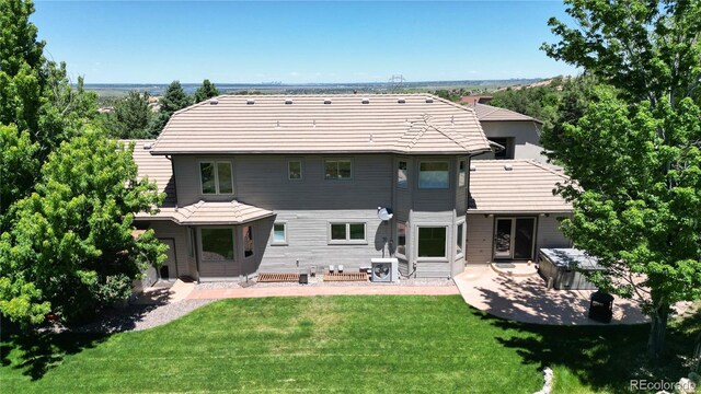 10886 Pheasant Run, Littleton, CO 80125 - back of house featuring a patio, a yard, and entry steps