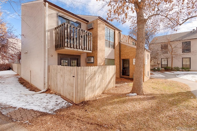 rear view of house featuring a balcony